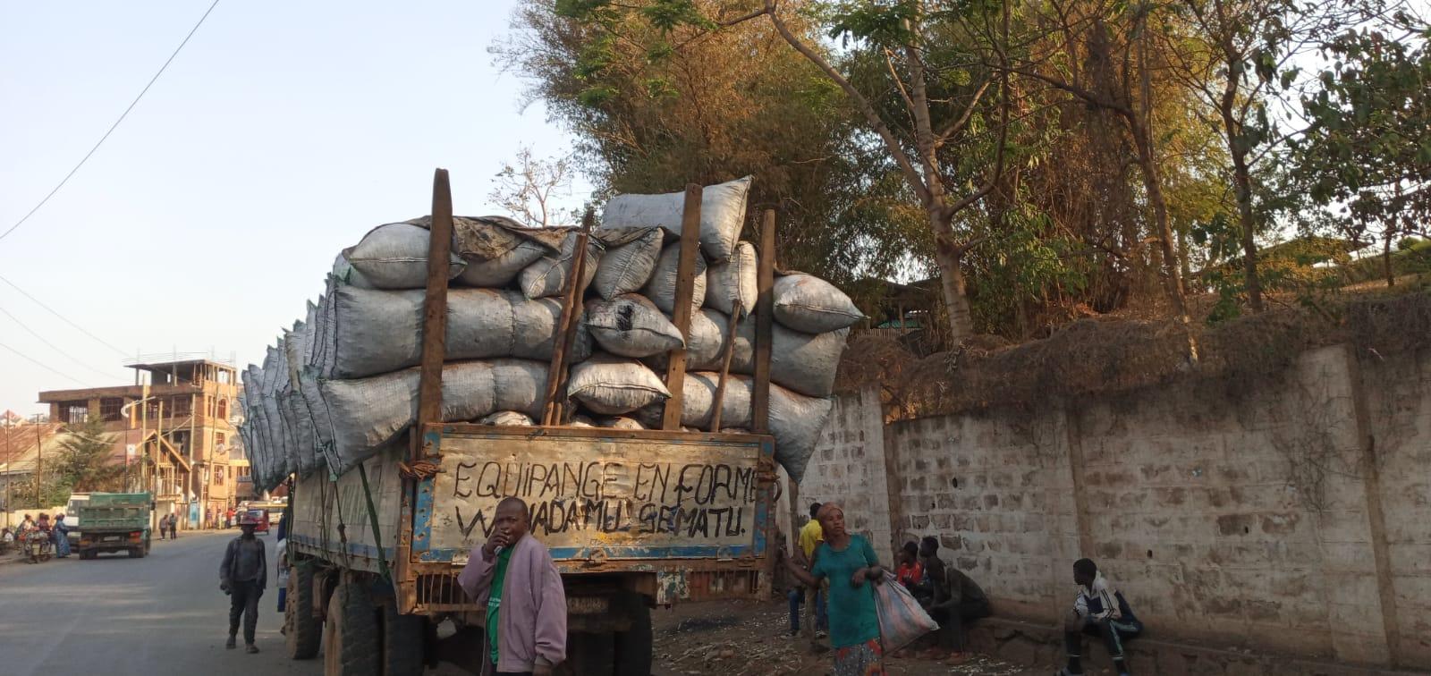 A truck carrying sacks of sand

Description automatically generated